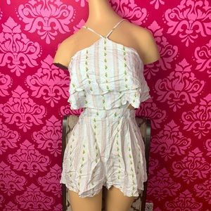 Forever 21 Floral romper with unique cut outs. Women’s small